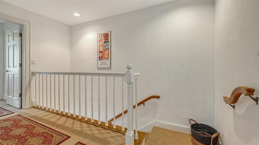 33 Bishopscourt Road, Unit 118 Osprey, FL 34229 - Photo 29 of 80 a view of a hallway with a window