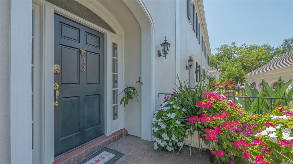 33 Bishopscourt Road, Unit 118 Osprey, FL 34229 - Photo 3 of 80 a flower plants in front of a door