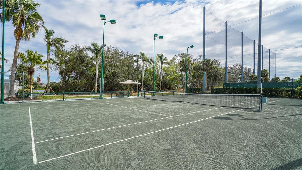 33 Bishopscourt Road, Unit 118 Osprey, FL 34229 - Photo 72 of 80 a view of a tennis court with palm trees