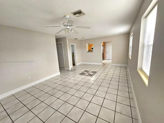 a view of an empty room and window