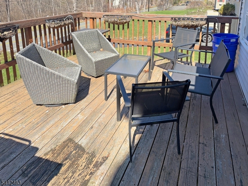62 Ridgeway Avenue Blairstown, NJ 07825 - Photo 11 of 11 a view of a chairs on the deck