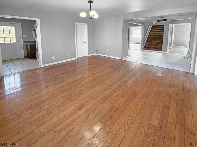 62 Ridgeway Avenue Blairstown, NJ 07825 - Photo 3 of 11 an empty room with wooden floor and windows