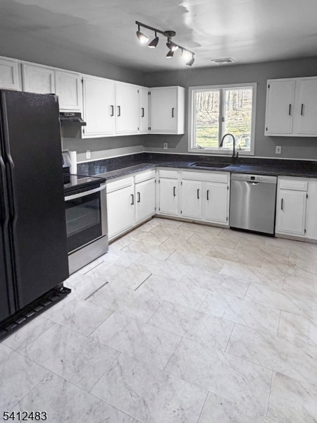 62 Ridgeway Avenue Blairstown, NJ 07825 - Photo 6 of 11 a large kitchen with stainless steel appliances granite countertop a stove a sink dishwasher and a refrigerator