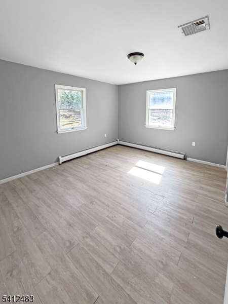 62 Ridgeway Avenue Blairstown, NJ 07825 - Photo 10 of 11 wooden floor in an empty room with a window