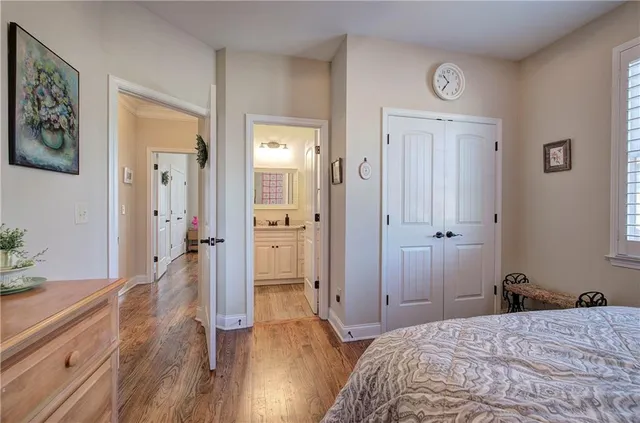 a bedroom with a bed and a large mirror in it