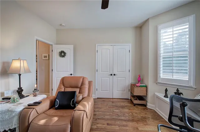a bedroom with furniture and a window