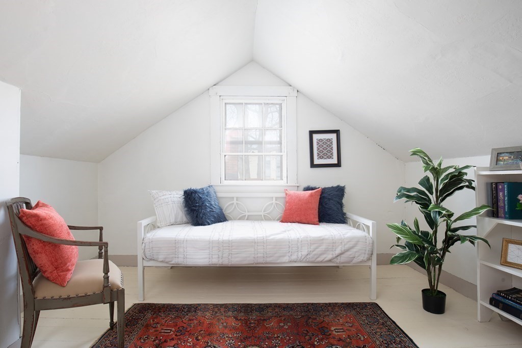 13 Yerxa Road Cambridge, MA 02140 - Photo 18 of 24 a bedroom with a large bed and a potted plant