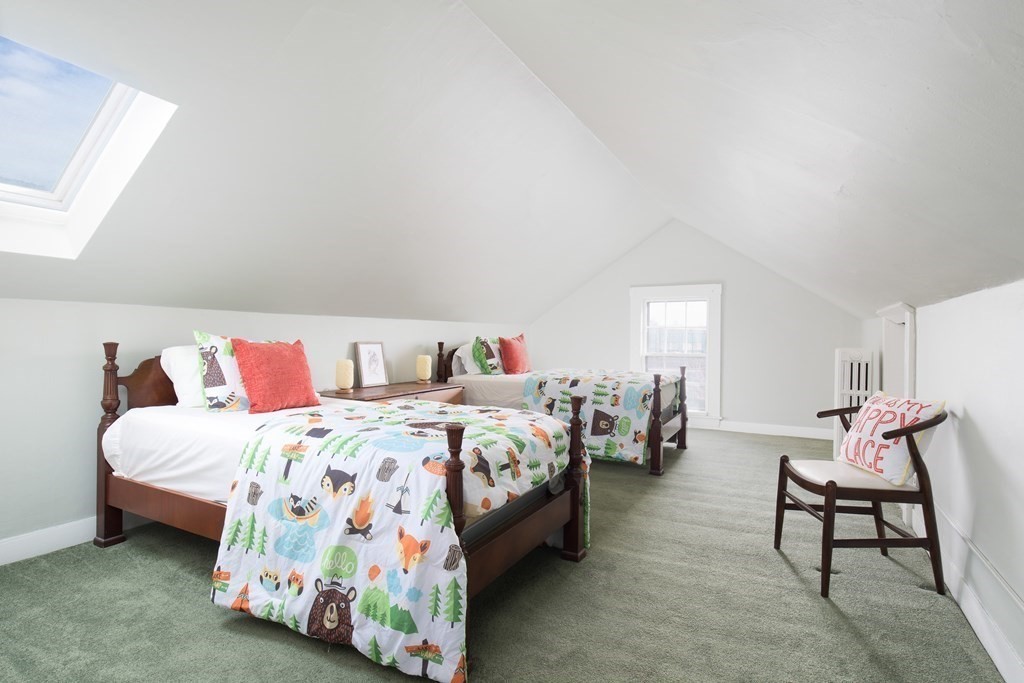 13 Yerxa Road Cambridge, MA 02140 - Photo 20 of 24 a bedroom with a bed and a lamp