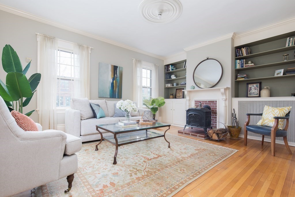 13 Yerxa Road Cambridge, MA 02140 - Photo 5 of 24 a living room with furniture a fireplace and a large window