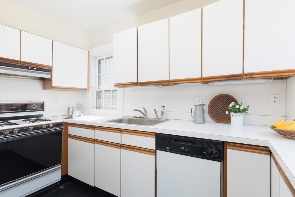 13 Yerxa Road Cambridge, MA 02140 - Photo 9 of 24 a kitchen with stainless steel appliances granite countertop a sink a stove and cabinets
