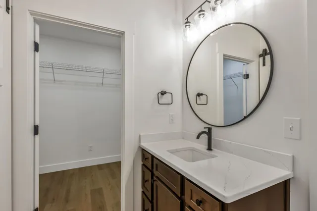 a bathroom with a sink and a mirror