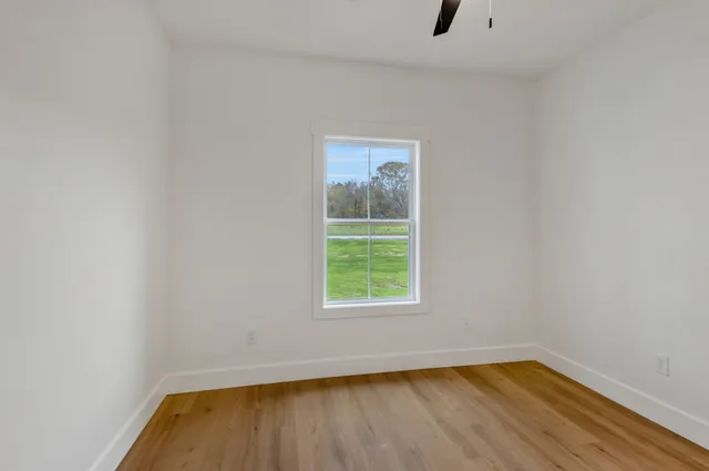 a view of a room that has a window in it