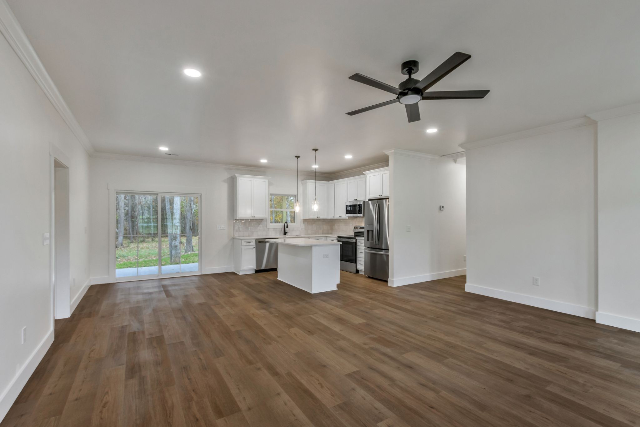482 Boswell Road Winchester, TN 37398 - Photo 6 of 36 a view of a kitchen with a sink and wooden floor
