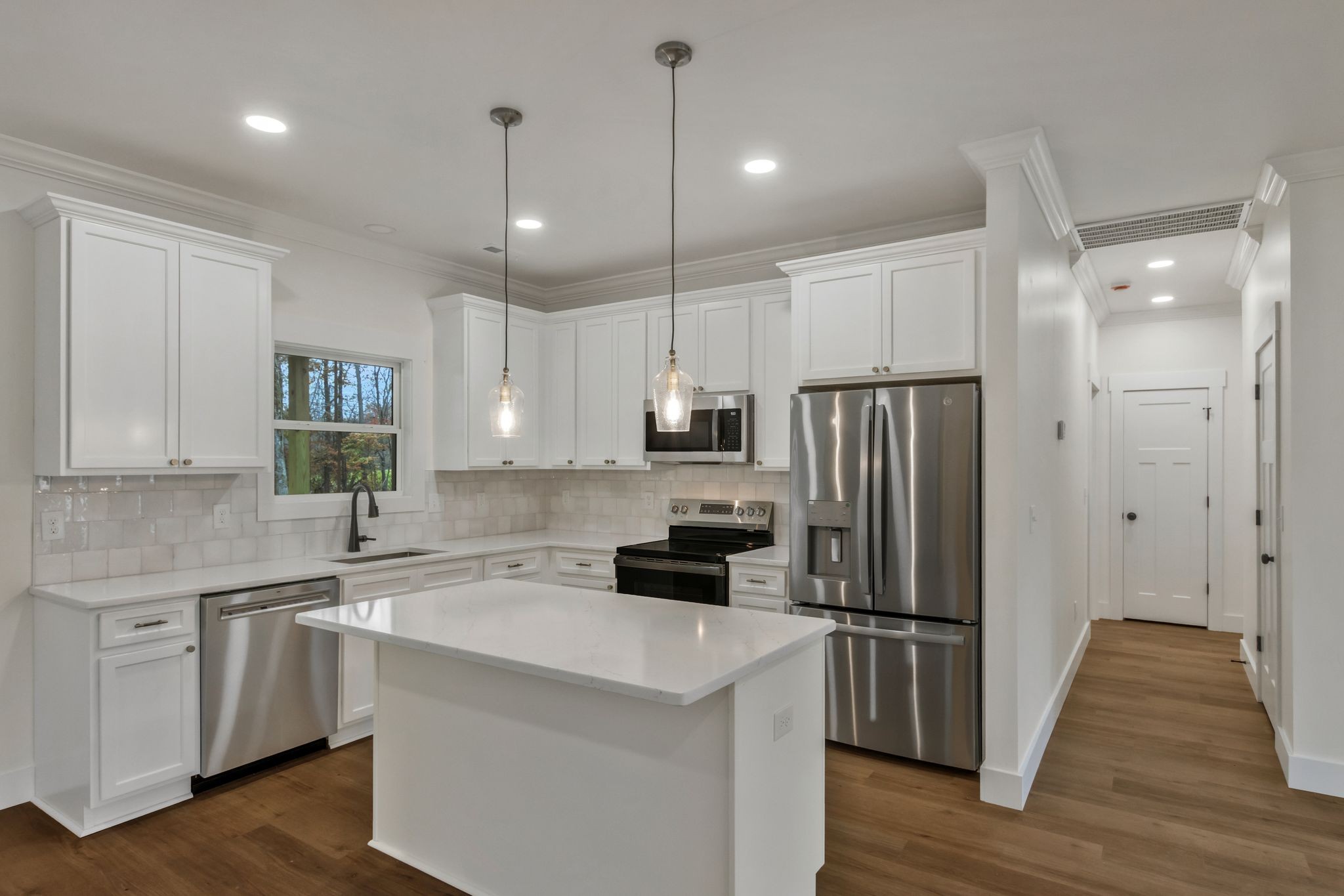 482 Boswell Road Winchester, TN 37398 - Photo 7 of 36 a kitchen with a refrigerator a sink and cabinets
