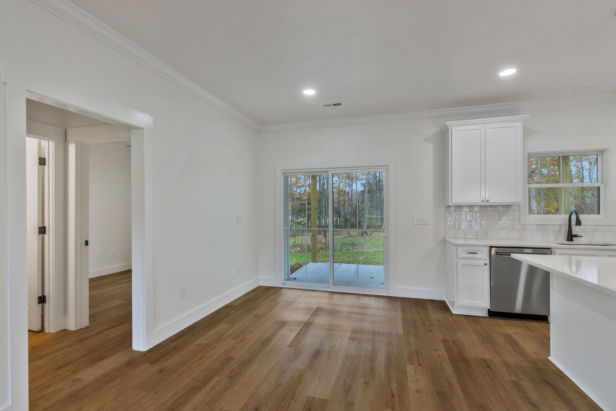 482 Boswell Road Winchester, TN 37398 - Photo 8 of 36 a view of a kitchen with a sink and dishwasher with wooden floor