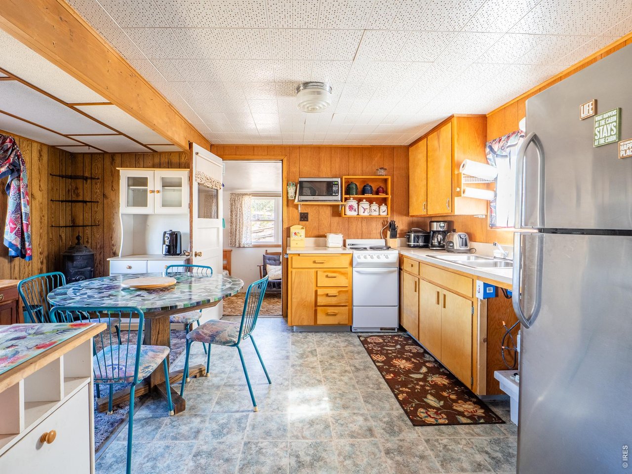 843 Nokomis Road Red Feather Lakes, CO 80545 - Photo 8 of 20 Kitchen and Dining Area
