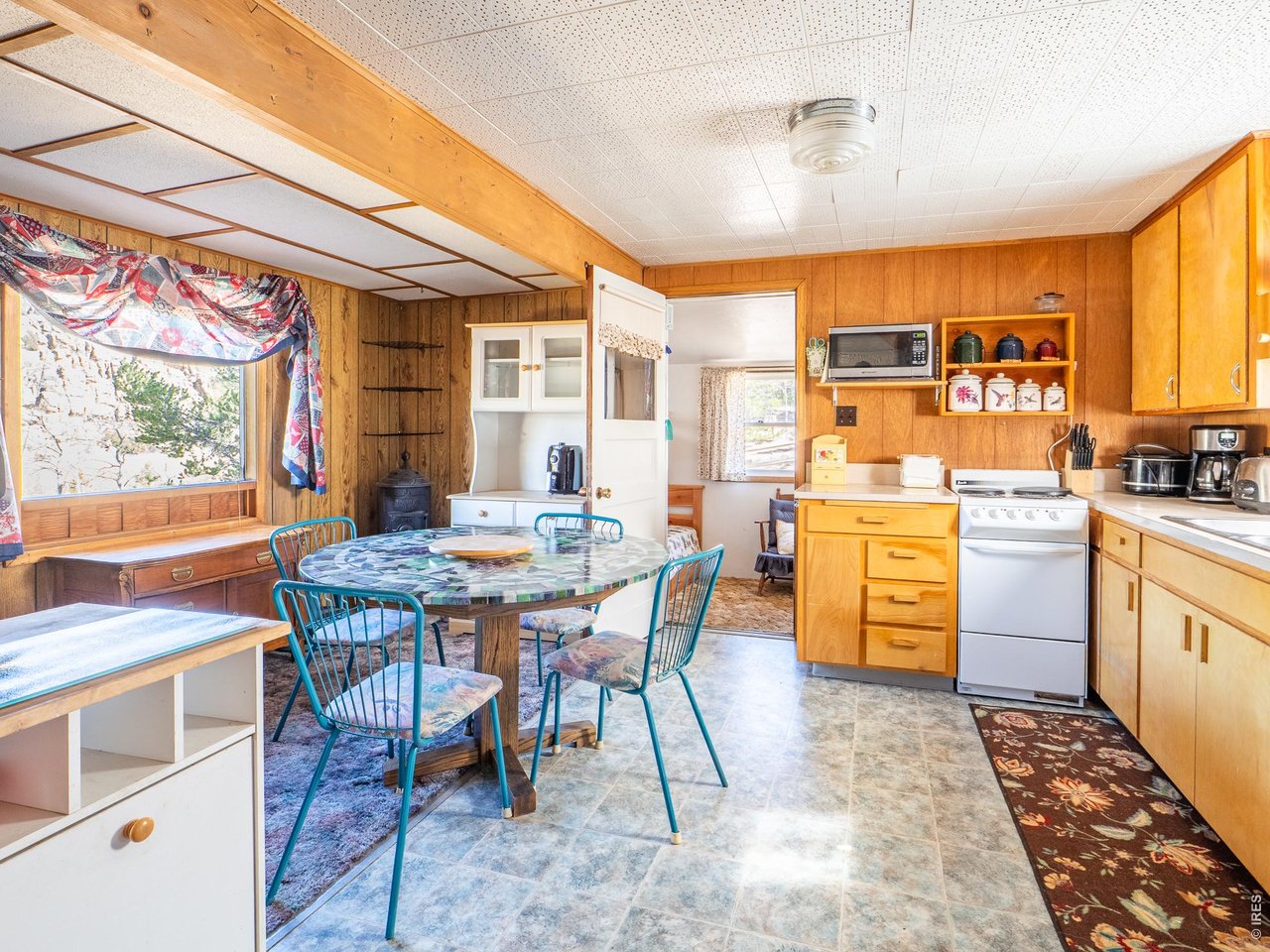 843 Nokomis Road Red Feather Lakes, CO 80545 - Photo 9 of 20 Kitchen and Dining Area