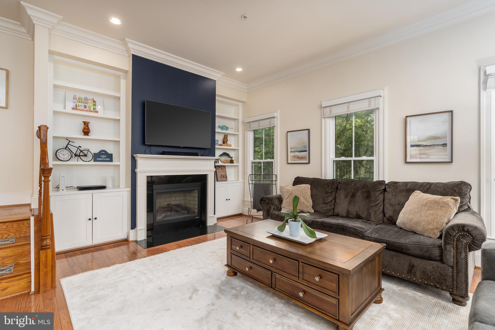 725 Carpenter Road Alexandria, VA 22314 - Photo 8 of 36 Living room complete with built-ins and fireplace