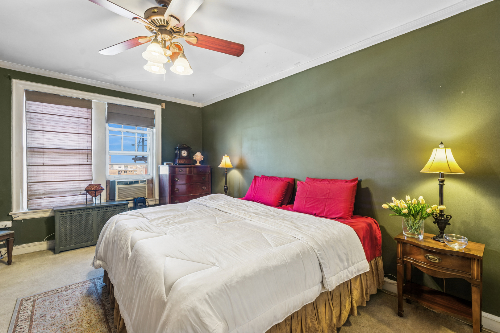 5000 North Marine Drive, Unit 9C Chicago, IL 60640 - Photo 17 of 20 a bed room with a bed and a chandelier