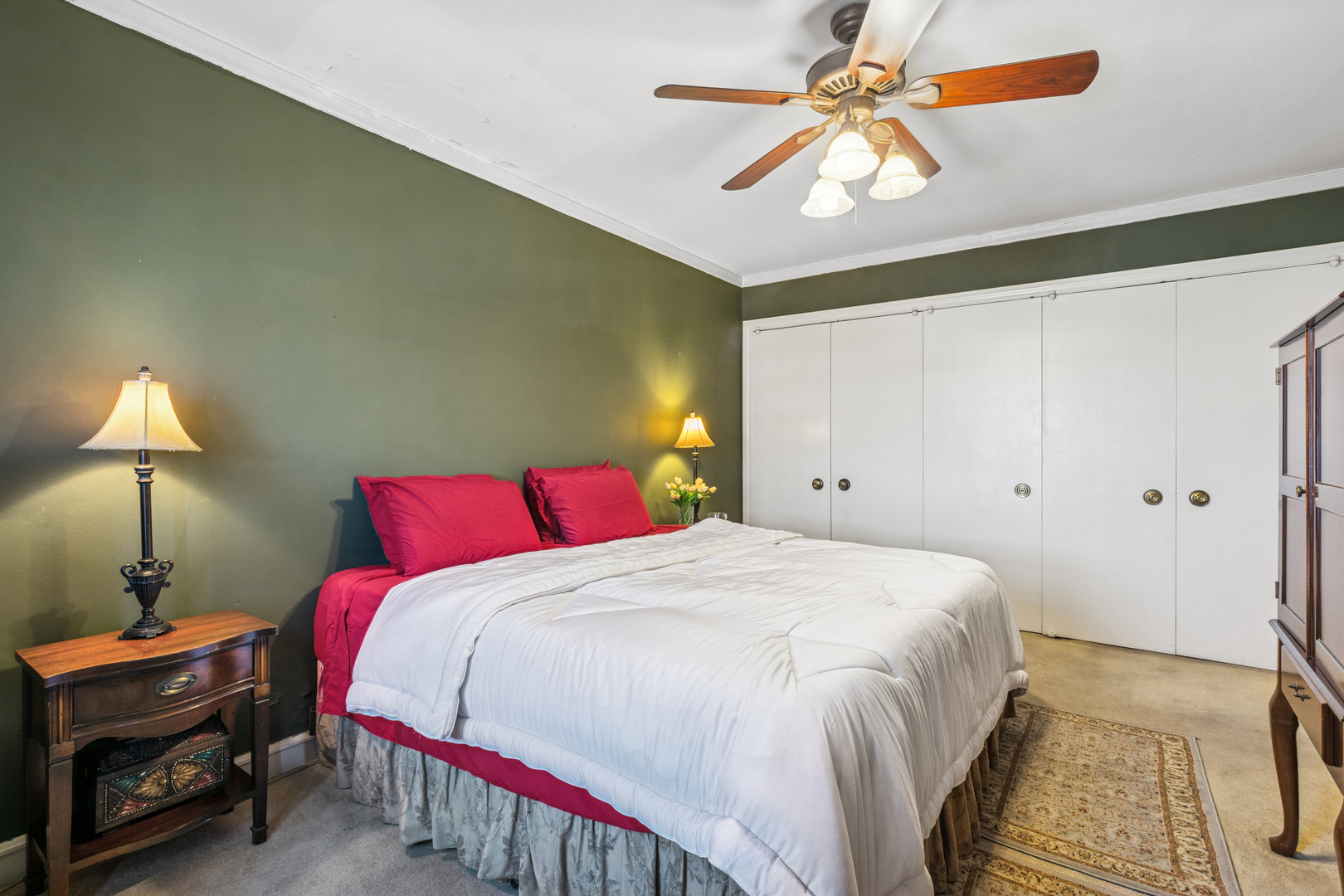 5000 North Marine Drive, Unit 9C Chicago, IL 60640 - Photo 18 of 20 a bedroom with a bed and a chandelier