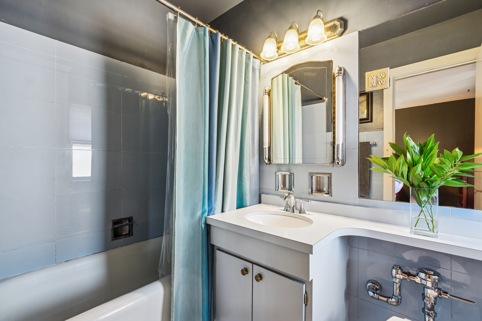 5000 North Marine Drive, Unit 9C Chicago, IL 60640 - Photo 19 of 20 a bathroom with a sink and a mirror