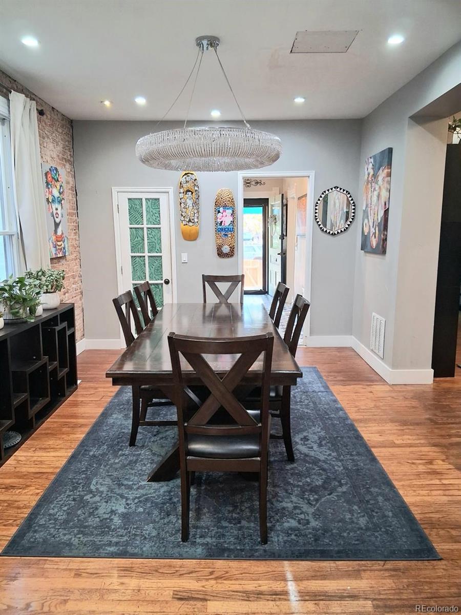 451 Acoma Street Denver, CO 80204 - Photo 13 of 19 a view of a dining room with furniture