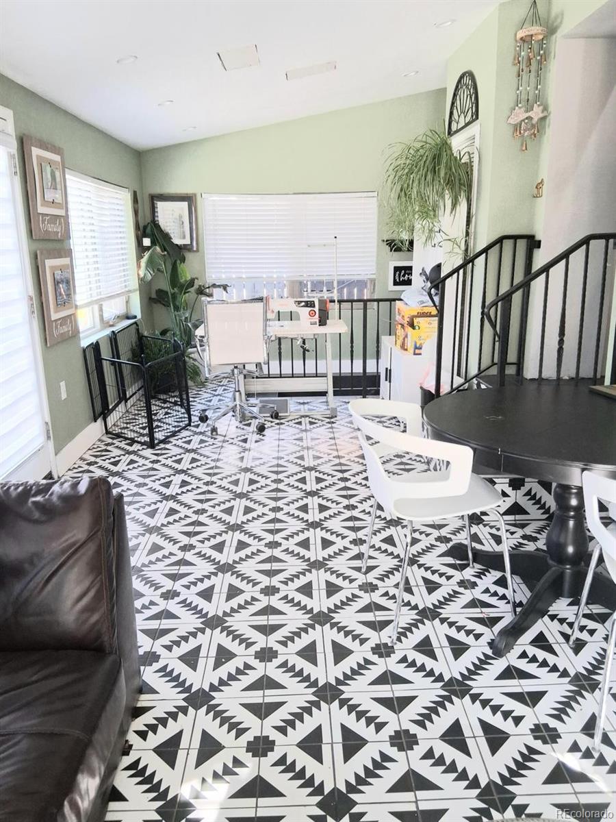 451 Acoma Street Denver, CO 80204 - Photo 19 of 19 a living room with a couch and a table