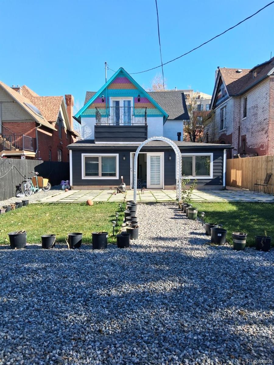 451 Acoma Street Denver, CO 80204 - Photo 2 of 19 a front view of a house with a yard