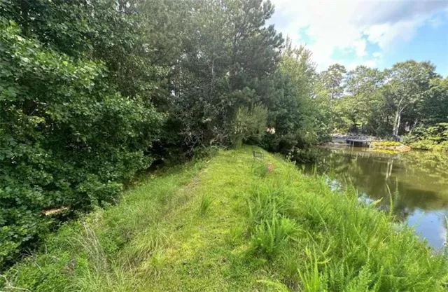 a swimming pool with wooden fence