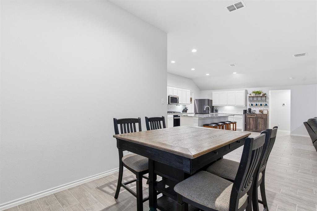 437 Falcon Way Azle, TX 76020 - Photo 15 of 40 a view of a dining room with furniture
