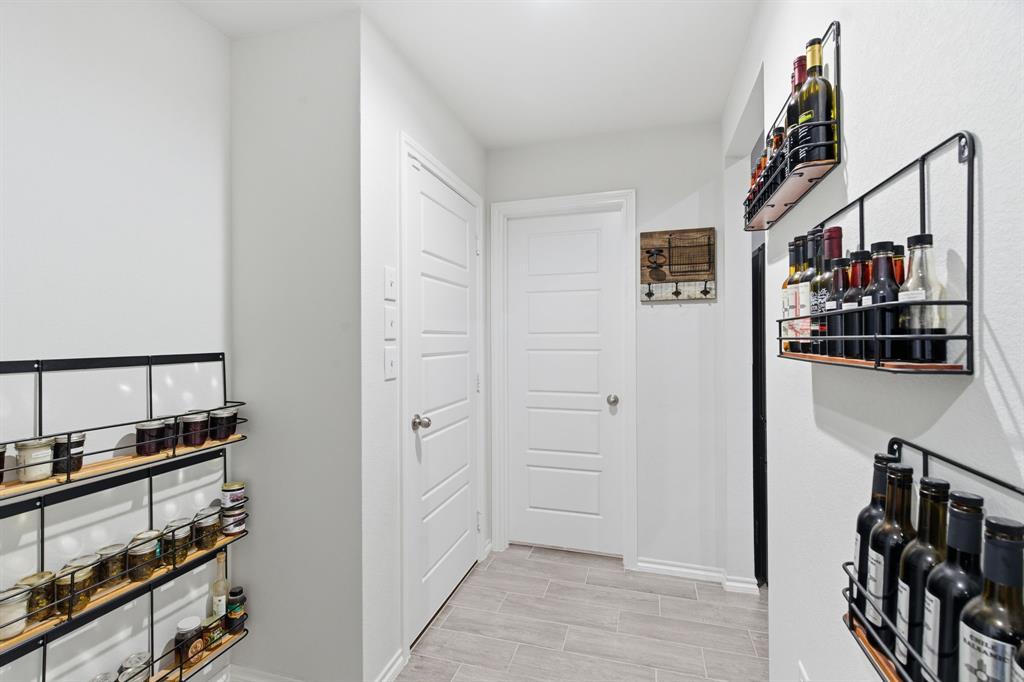 437 Falcon Way Azle, TX 76020 - Photo 18 of 40 a view of a hallway with workspace and entryway
