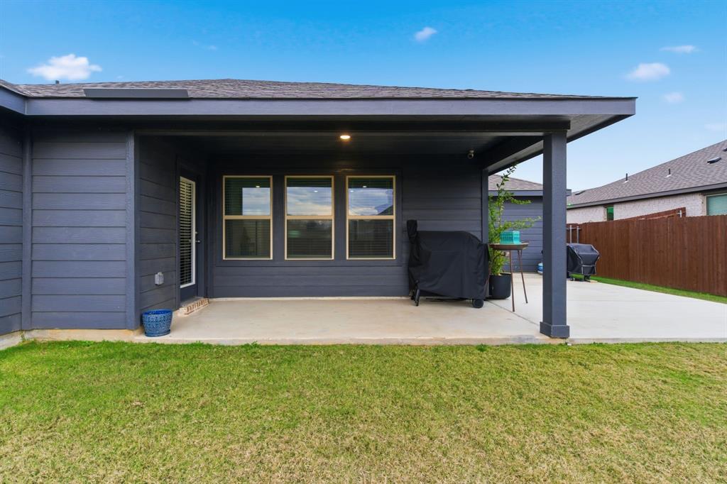 437 Falcon Way Azle, TX 76020 - Photo 32 of 40 a front view of a house with garden