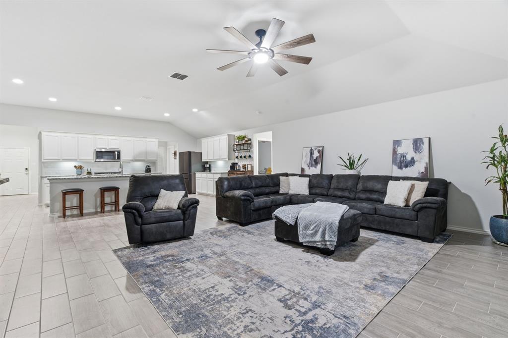 437 Falcon Way Azle, TX 76020 - Photo 8 of 40 a living room with furniture and kitchen view
