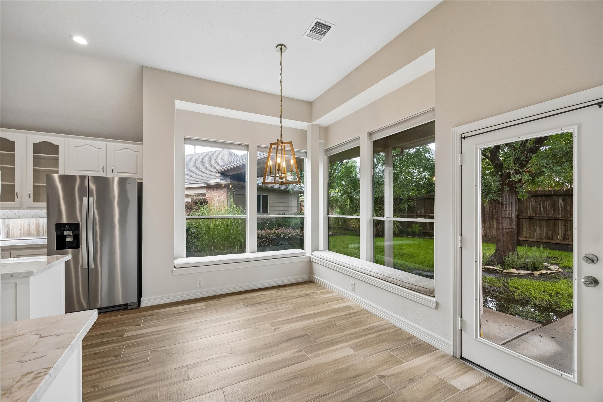 5306 Summerland Ridge Court Houston, TX 77041 - Photo 14 of 33 a view of an entryway with wooden floor and a window