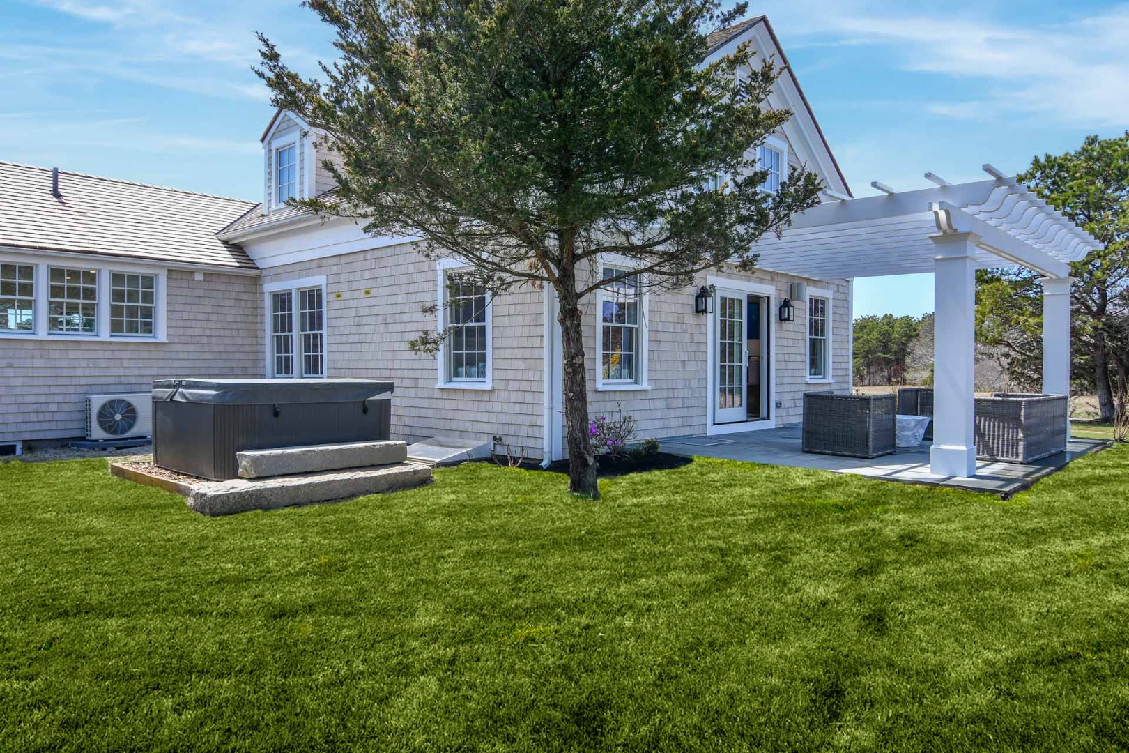 30 Mill Hill Road Edgartown, MA 02539 - Photo 3 of 35 a view of a house with a backyard and porch