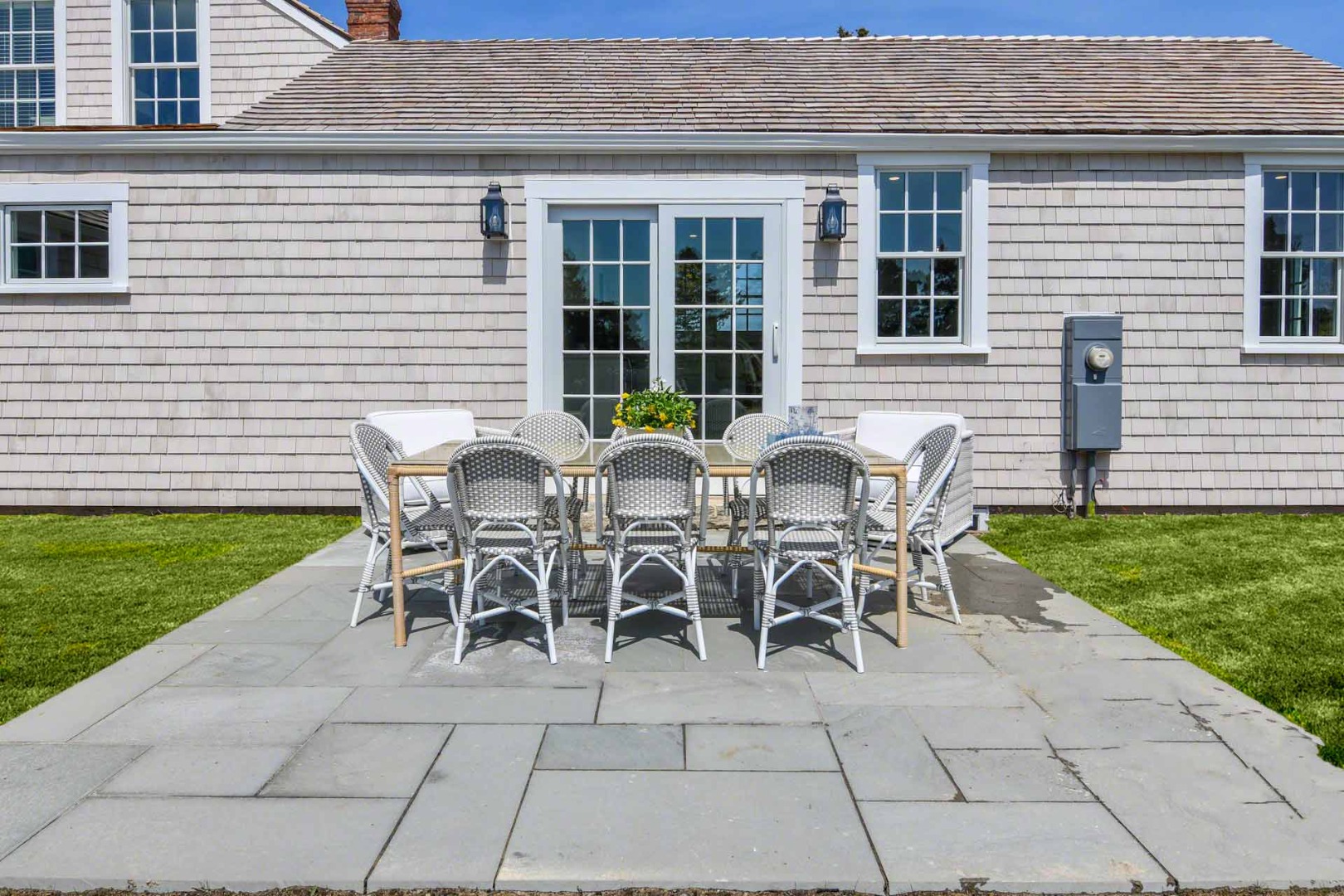 30 Mill Hill Road Edgartown, MA 02539 - Photo 33 of 35 a view of a backyard with table and chairs