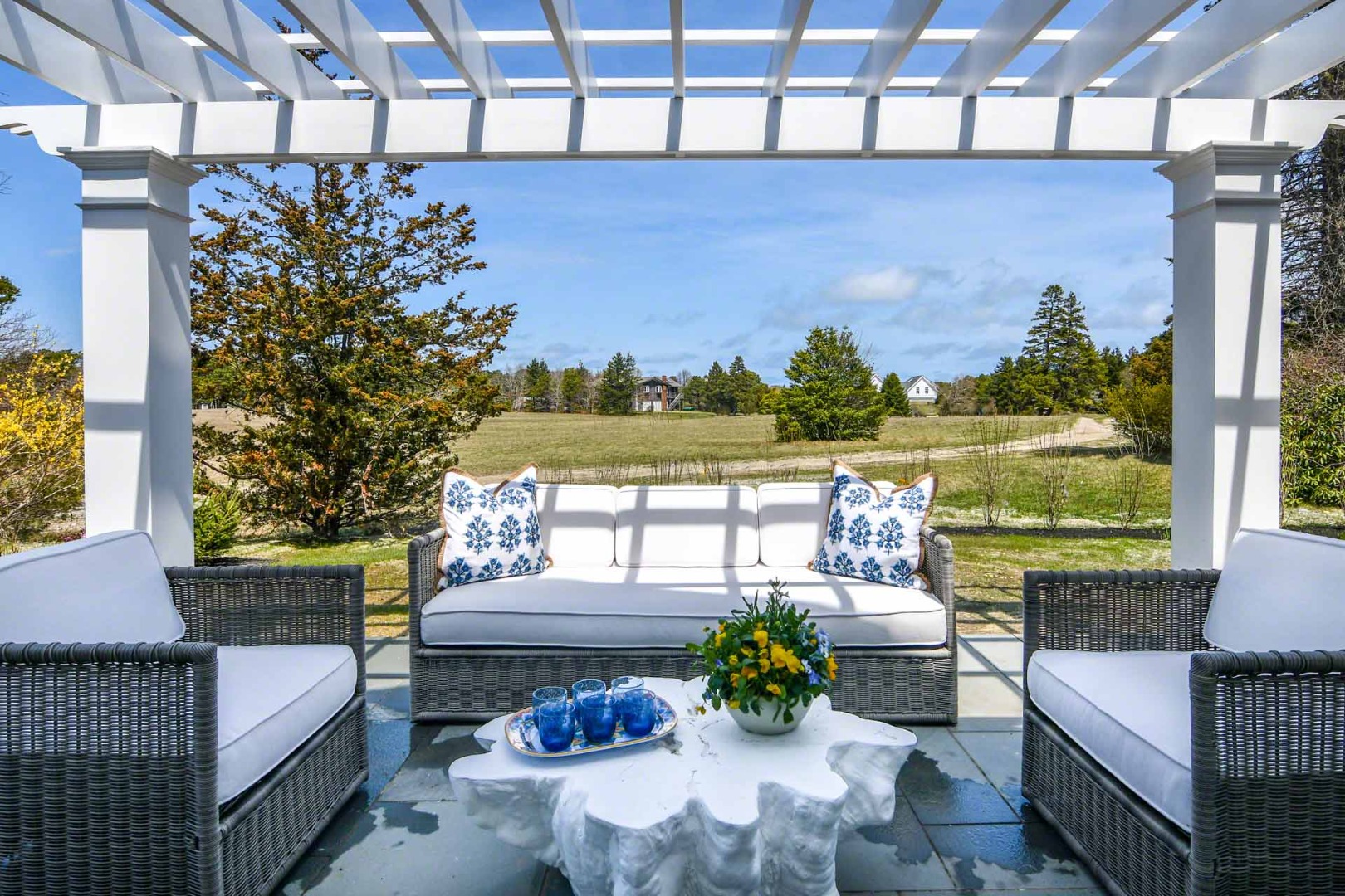 30 Mill Hill Road Edgartown, MA 02539 - Photo 5 of 35 a balcony with furniture and a potted plant
