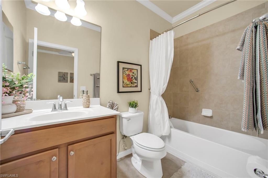 14513 Lanier Court Naples, FL 34114 - Photo 11 of 42 Ensuite bathroom with tiled shower / bath combo