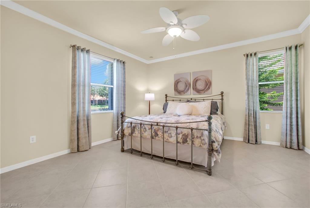 14513 Lanier Court Naples, FL 34114 - Photo 12 of 42 Bedroom featuring crown molding, ceiling fan and natural light