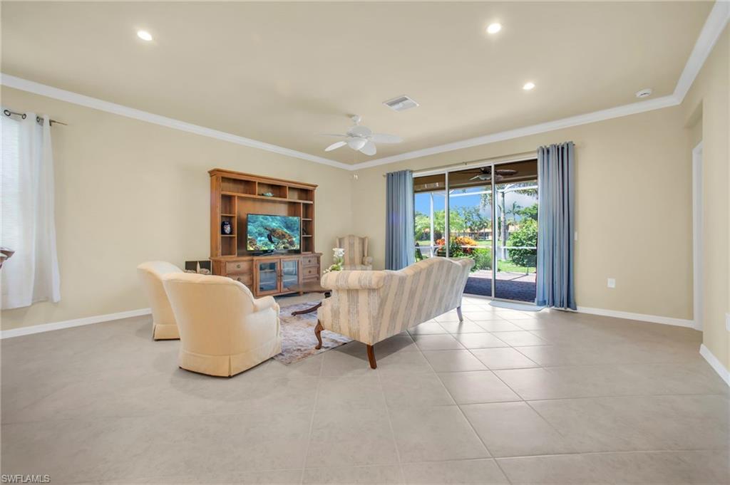 14513 Lanier Court Naples, FL 34114 - Photo 23 of 42 Living area featuring crown molding, recessed lighting, tile flooring, and ceiling fan