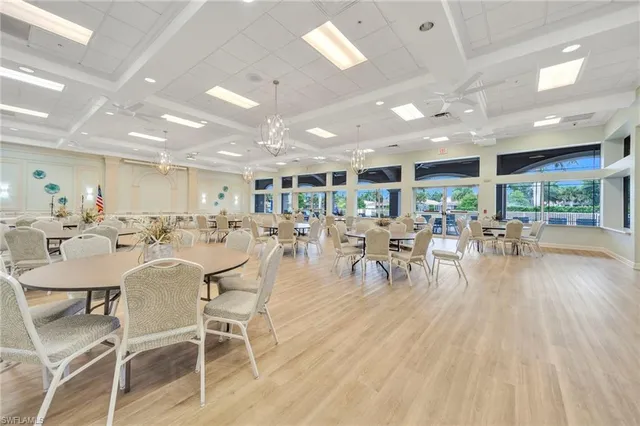 a view of a dining room with furniture floor and a view of kitchen