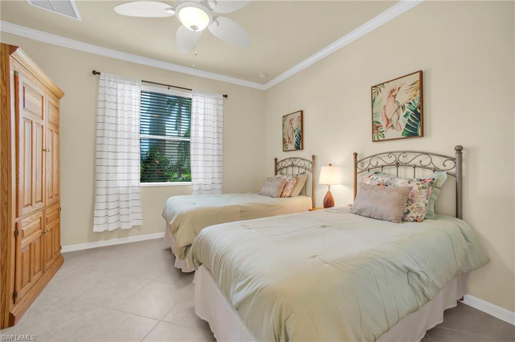 14513 Lanier Court Naples, FL 34114 - Photo 5 of 42 Bedroom with crown molding, tile flooring, and ceiling fan.