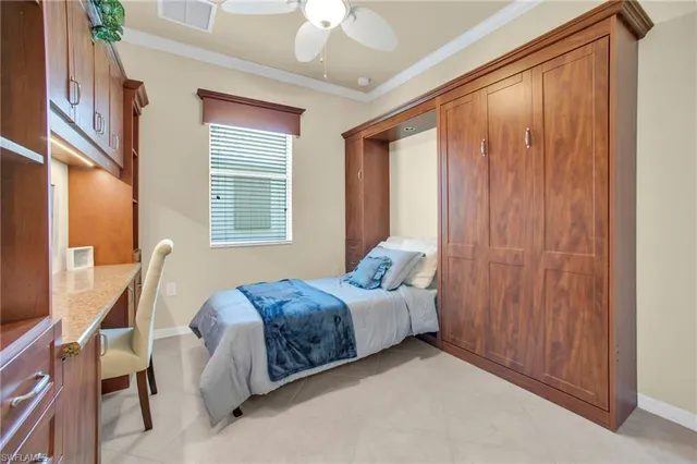 a bed room with a bed and a window