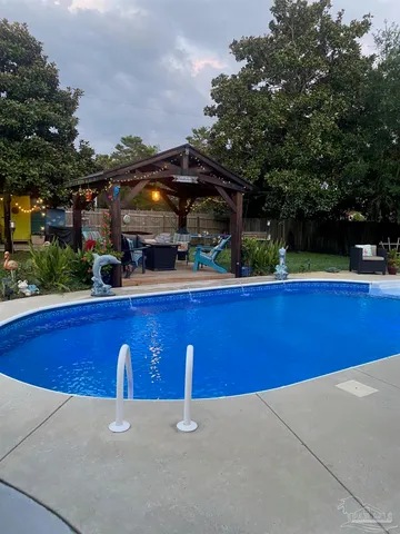 a bathroom with a sink toilet vanity and shower