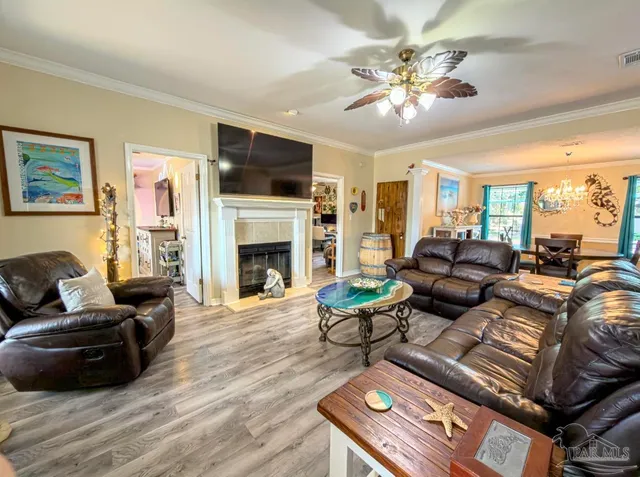 a bedroom with furniture and a flat screen tv