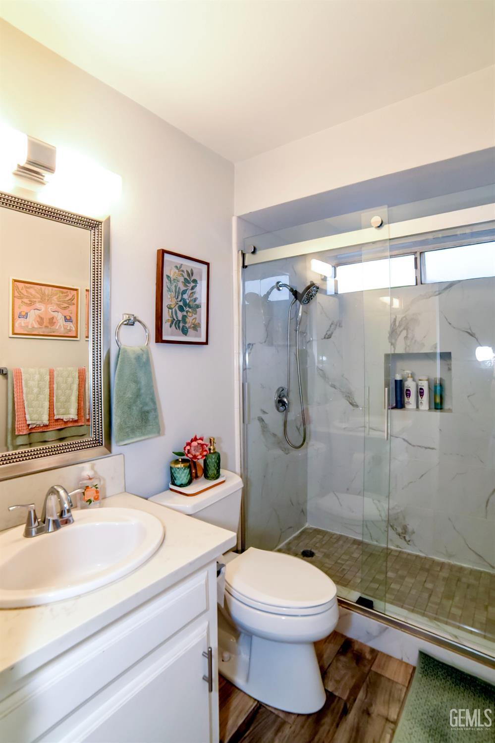 Undisclosed Address Wasco, CA 93280 - Photo 12 of 22 a bathroom with a sink a toilet and shower