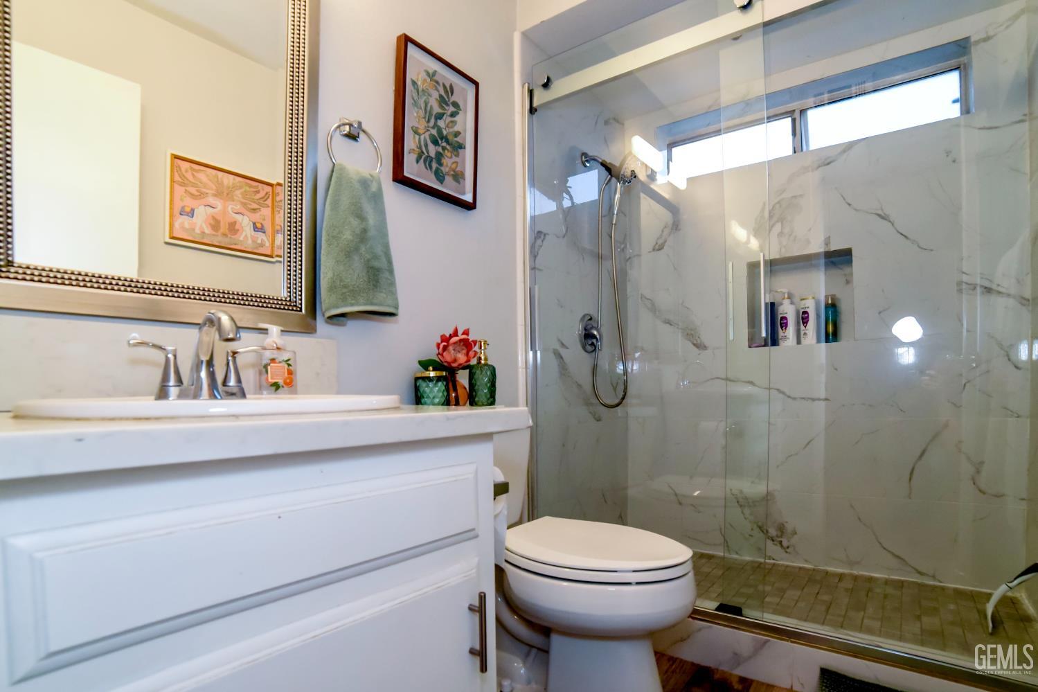 Undisclosed Address Wasco, CA 93280 - Photo 13 of 22 a bathroom with a sink toilet and shower