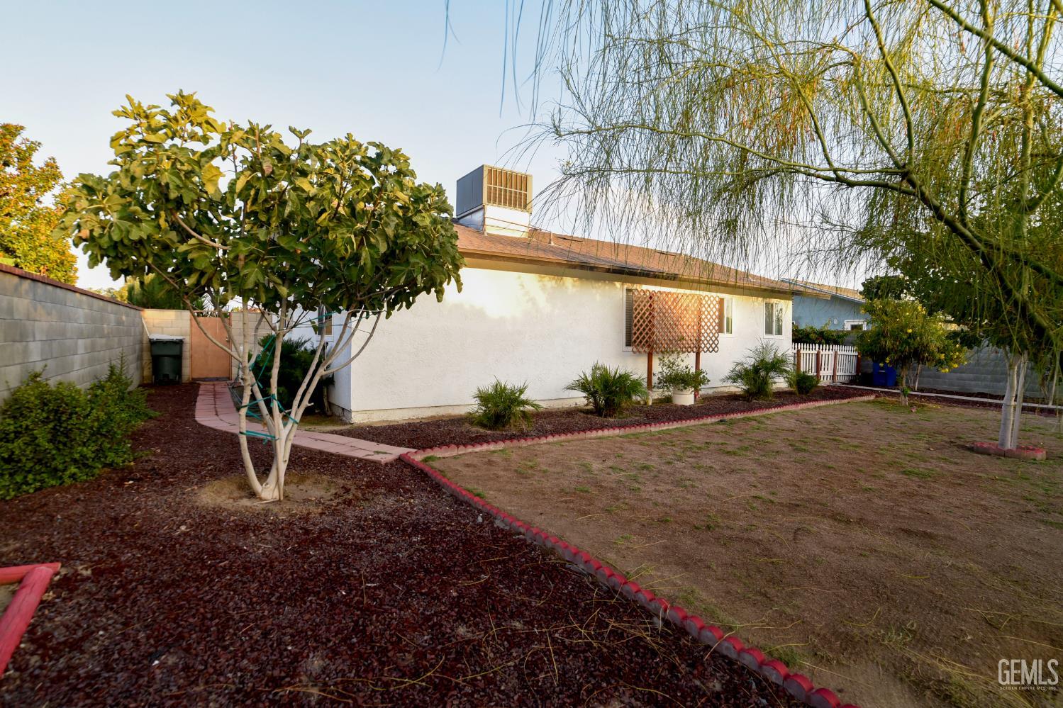 Undisclosed Address Wasco, CA 93280 - Photo 19 of 22 a street view with large trees