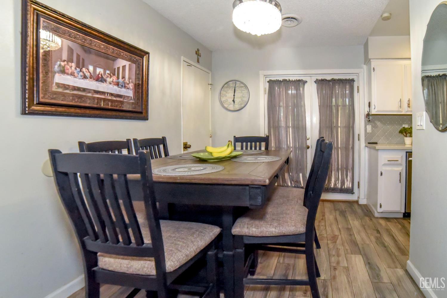 Undisclosed Address Wasco, CA 93280 - Photo 5 of 22 a view of a dining room with furniture and wooden floor