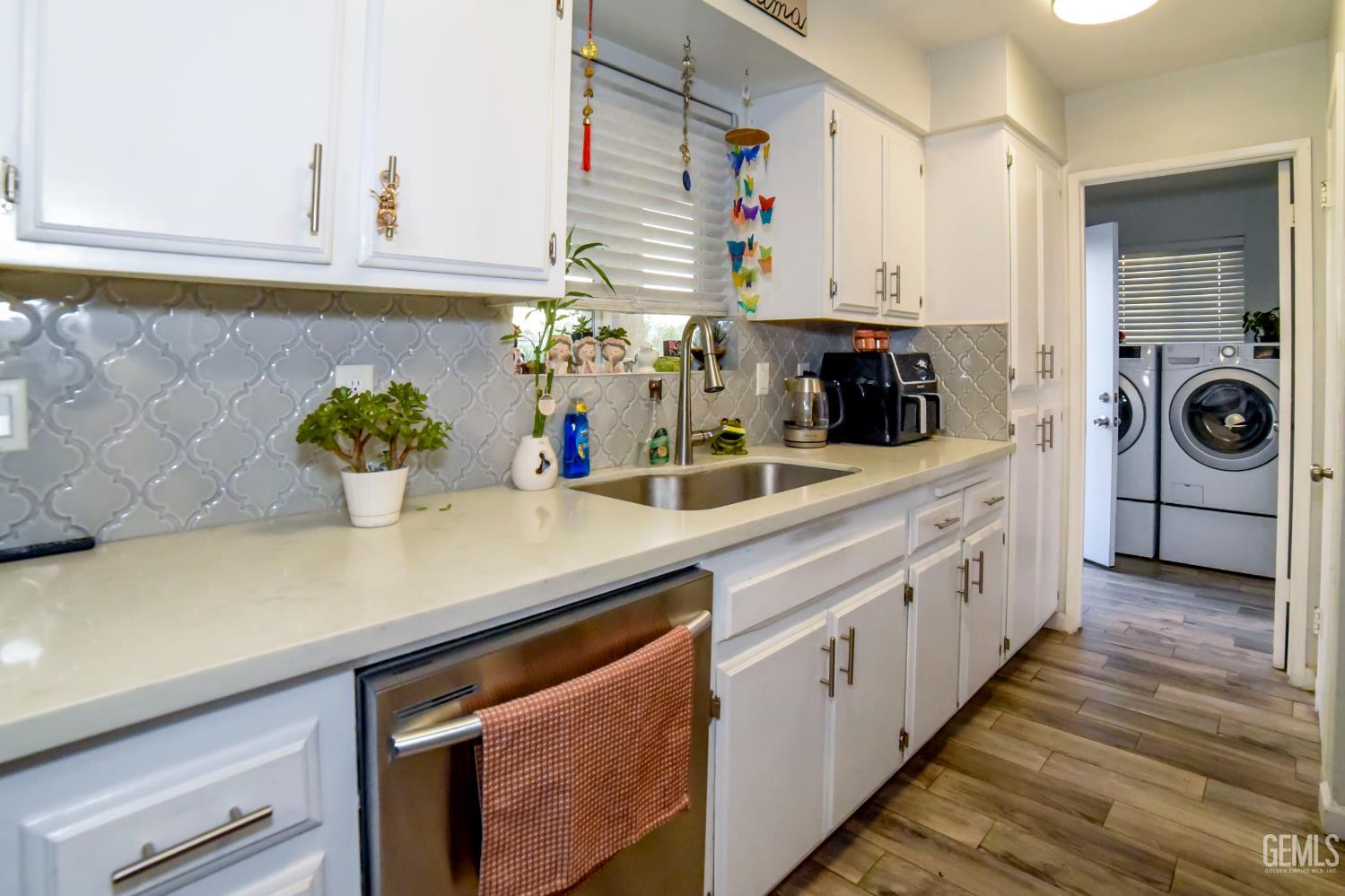 Undisclosed Address Wasco, CA 93280 - Photo 8 of 22 a kitchen with cabinets a sink and a stove